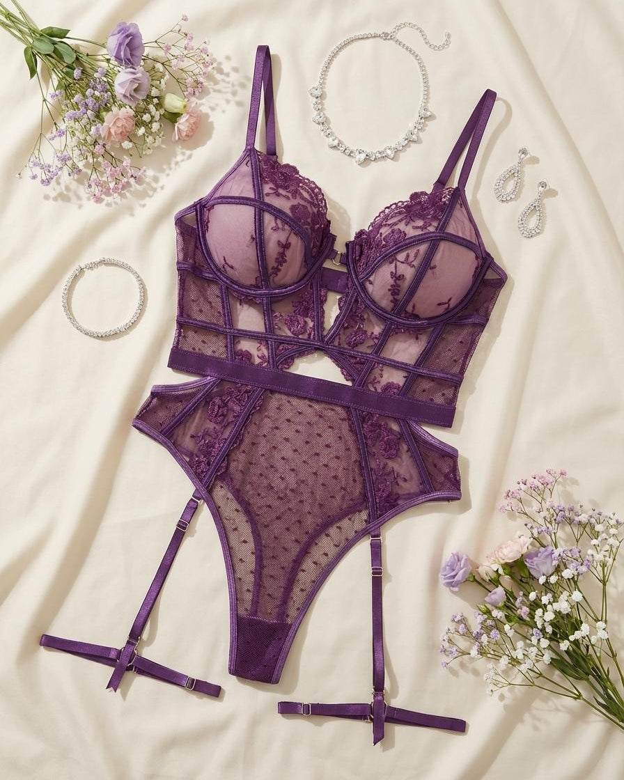 Purple embroidered lace bodysuit with adjustable straps and mesh panels