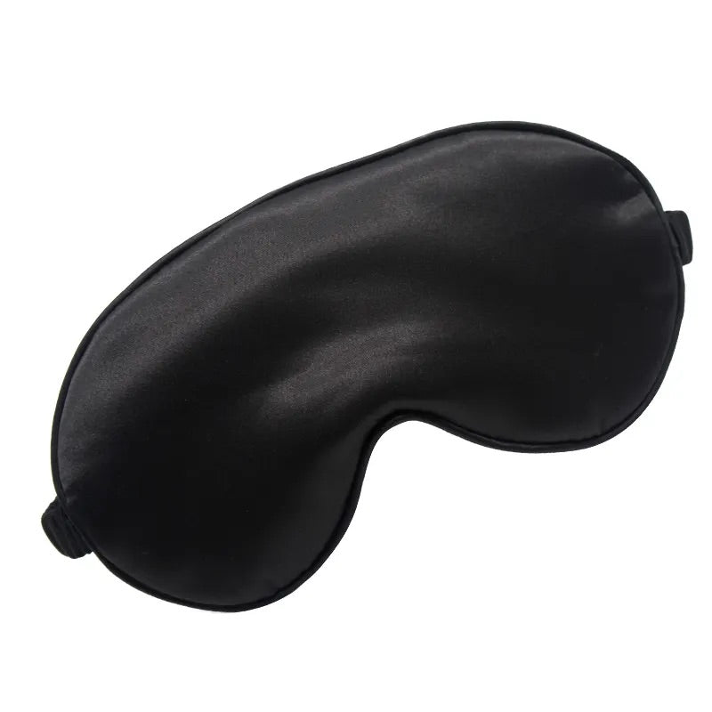 Luxurious black silk sleep mask for comfort, style, and deep rest.