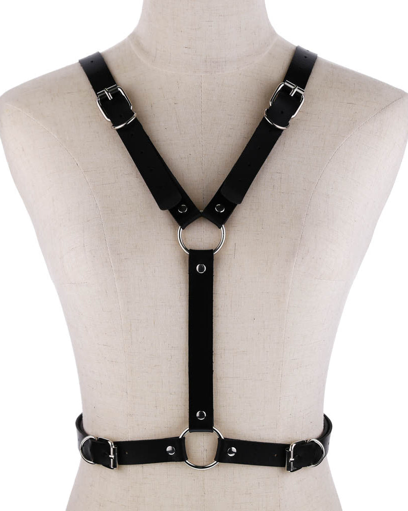 Faux leather harness with wing-shaped back detail on mannequin, front view