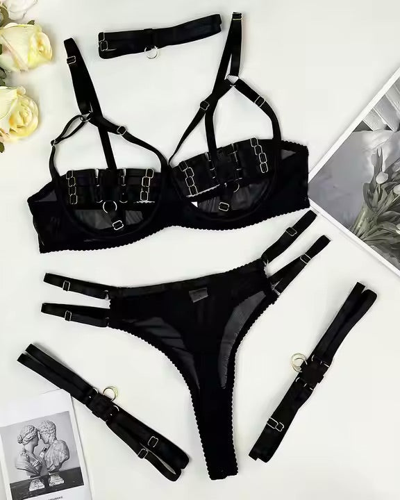Flat lay image 5 piece multi adjustable black lingerie set from The Blackmarket Lingerie