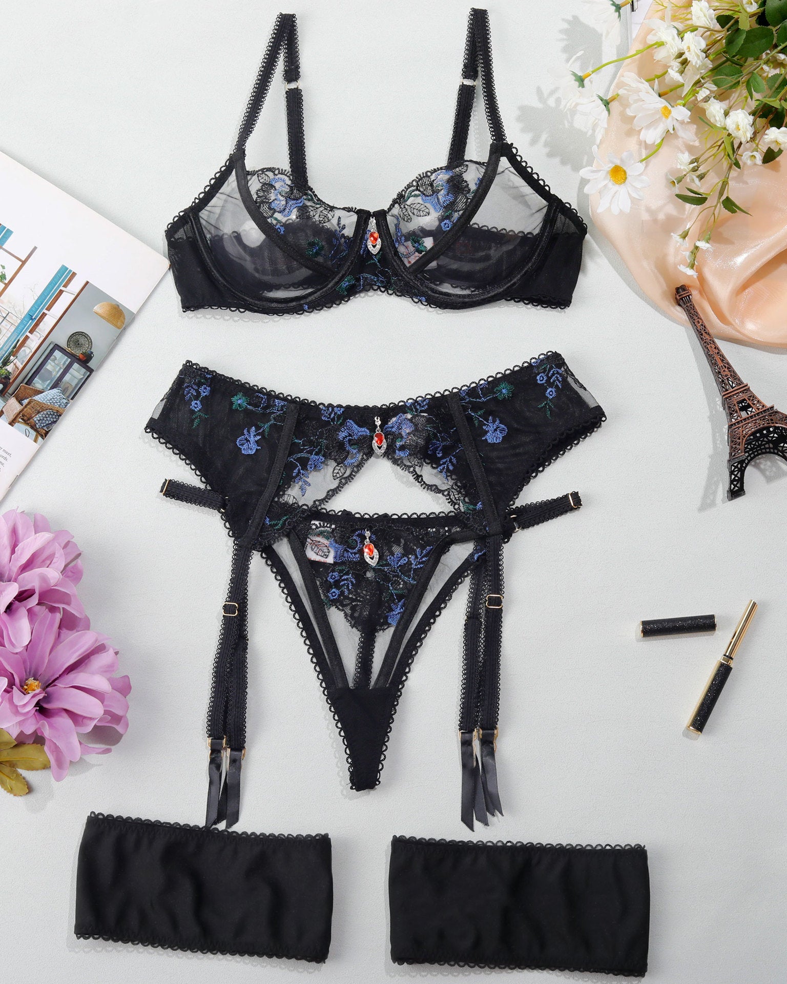 Full set displayed flat lay including bra, garter belt, thong and garters