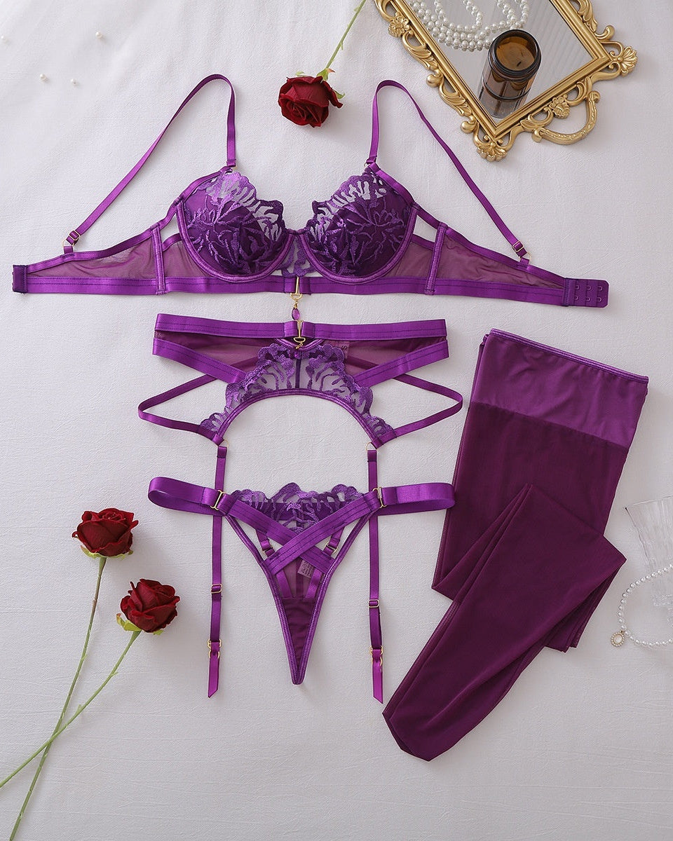 Risky Business purple four-piece lingerie and stocking set flat lay