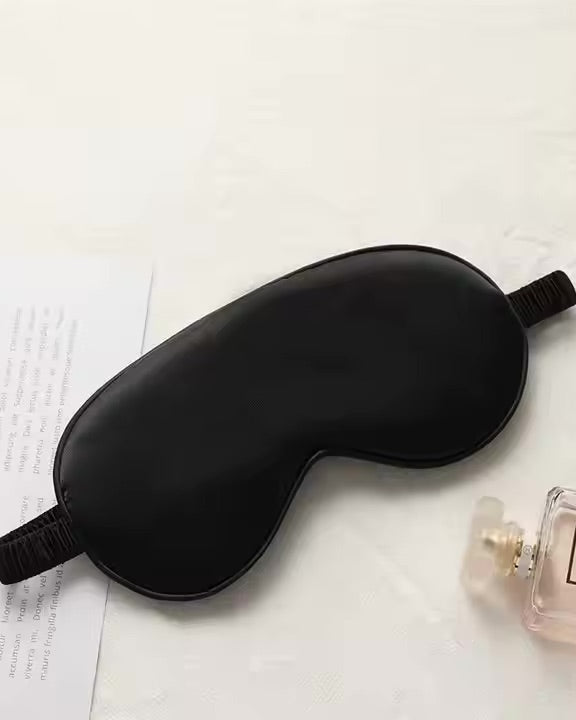 Luxurious black silk sleep mask for comfort, style, and deep rest.