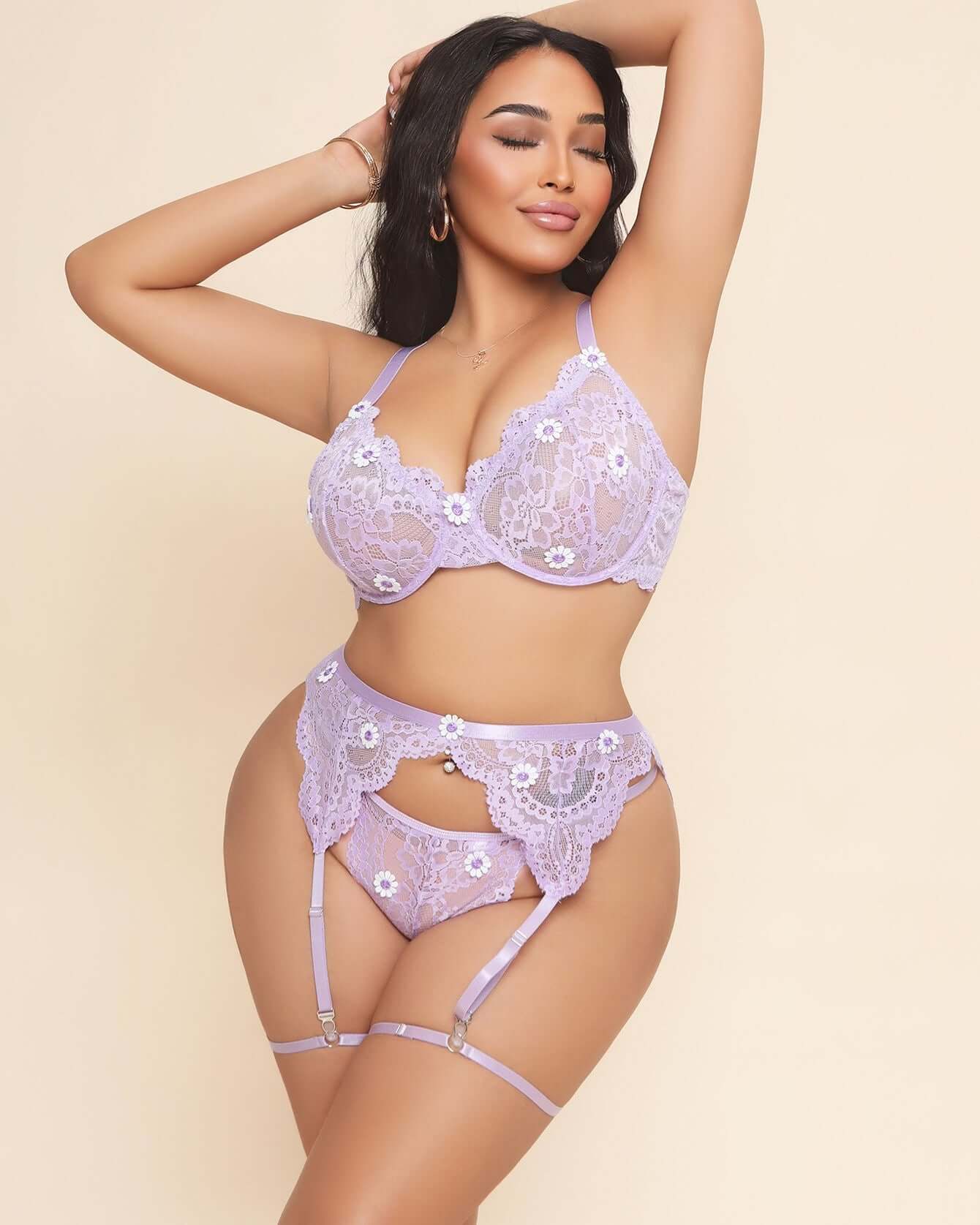 Plus size woman wearing a lavender lace lingerie set on a beige background