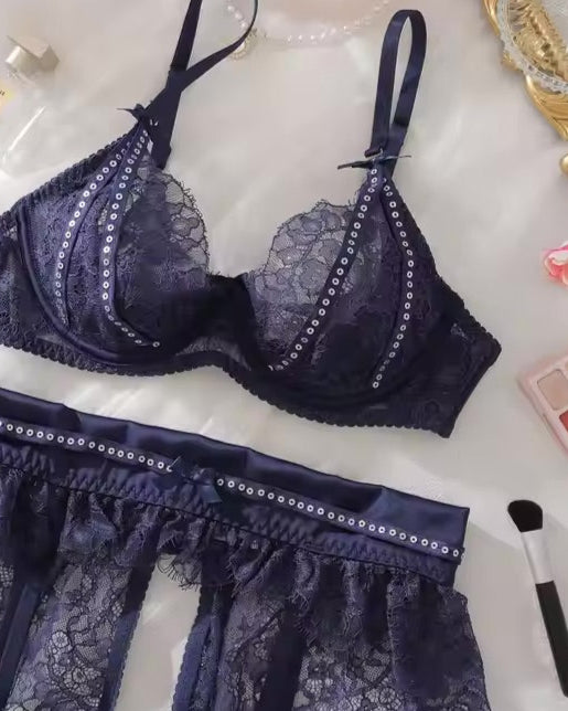 Navy lace bra and garter belt details from the Twilight Hour lingerie set by The Blackmarket Lingerie