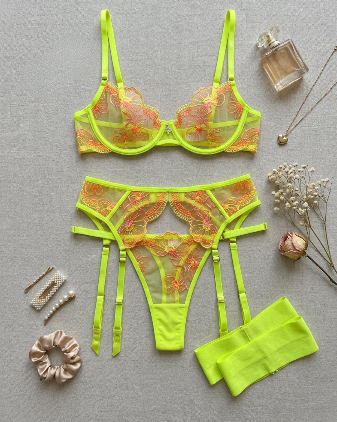 bright lace lingerie set featuring bra, garter belt, G-string and garters