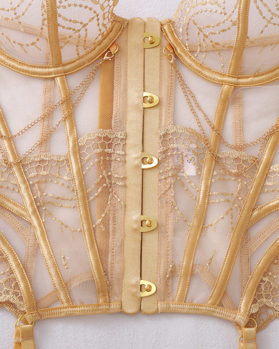 Luxury champagne gold lingerie featuring structured underwire cups and corset-inspired styling.
