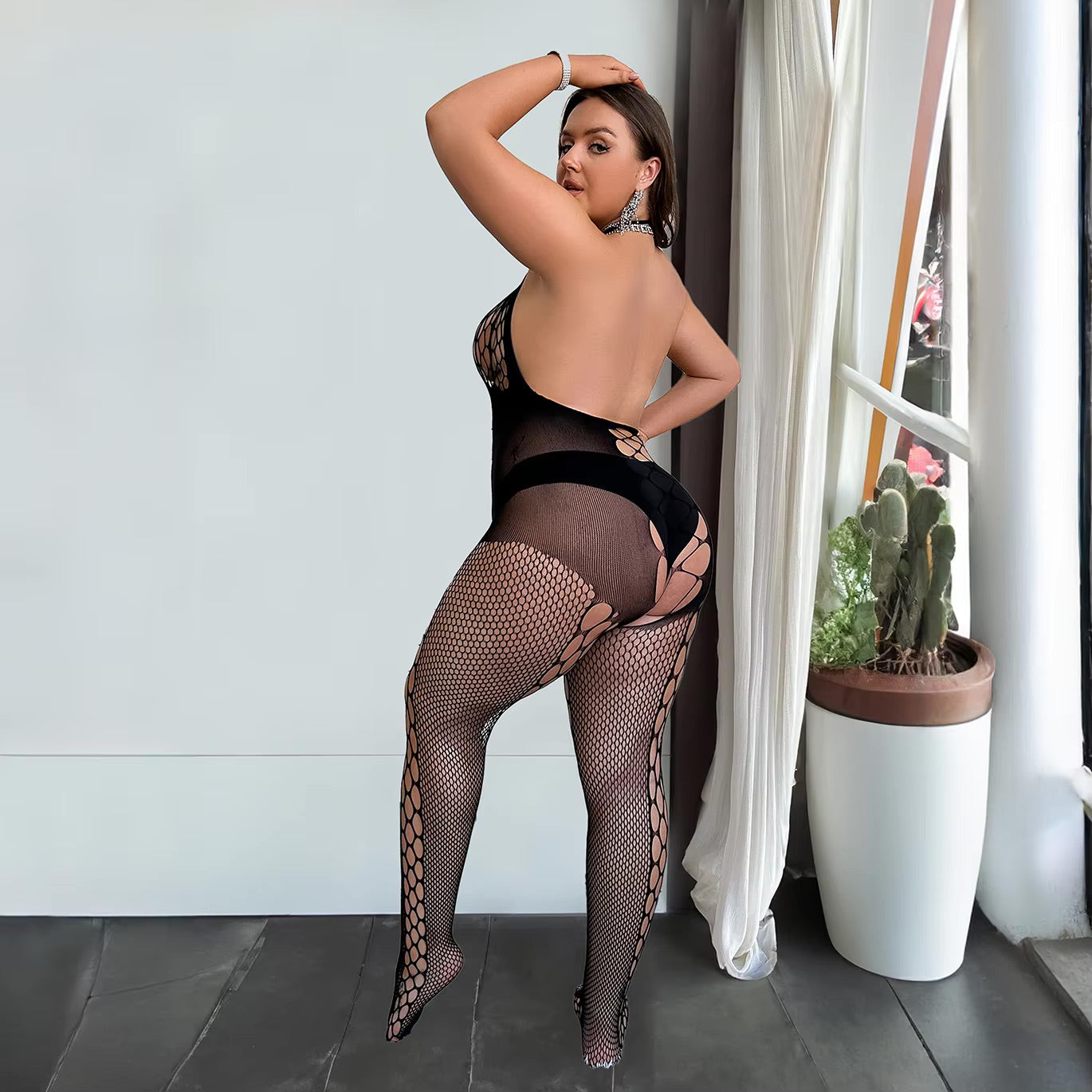 Curvy woman  black stretch lingerie bodystocking. The Blackmarket Lingerie