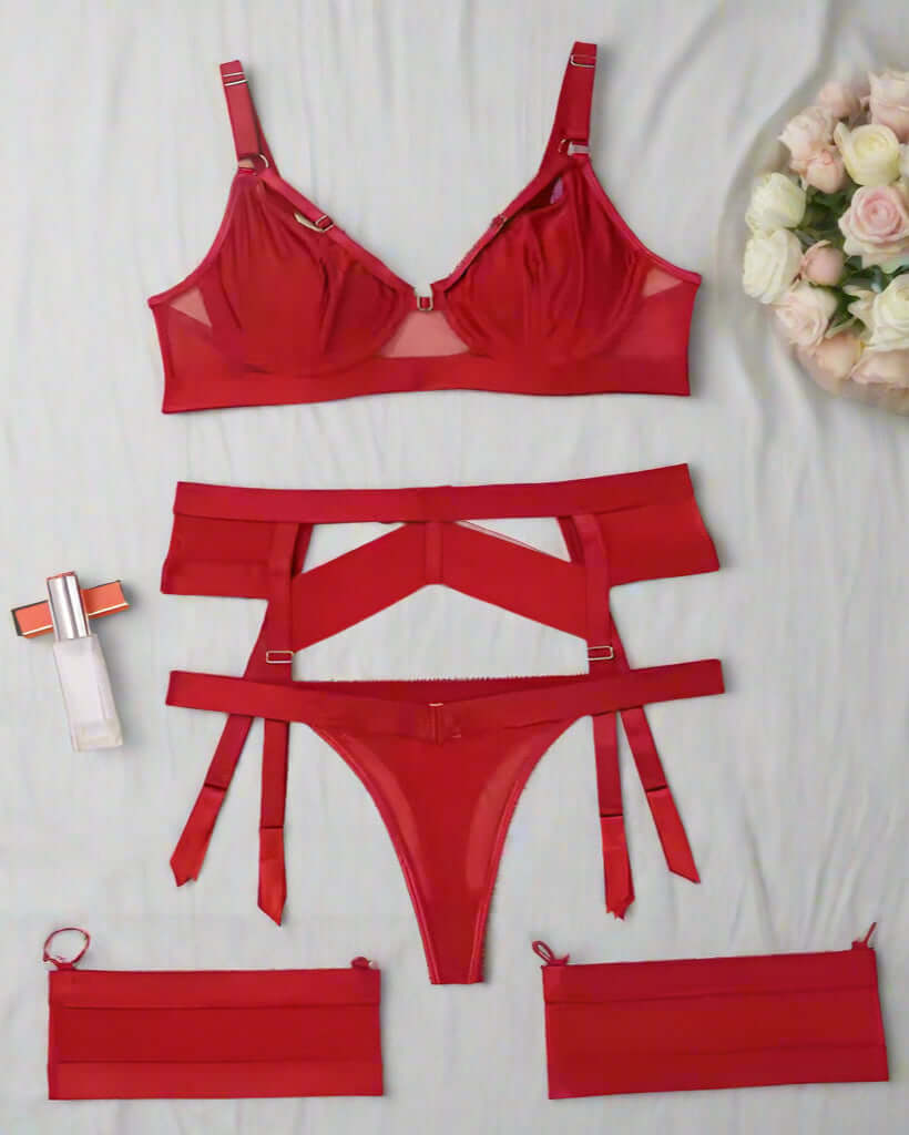 Red lingerie set with matching garter belt on a beige background