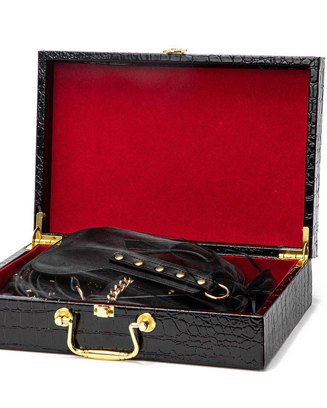 Obey Me boxed BDSM experience kit with gold chain detail and paddle