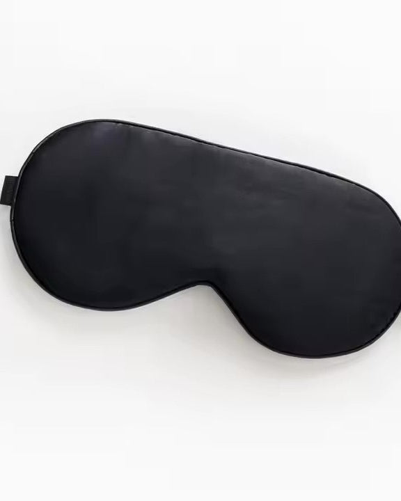 Luxurious black silk sleep mask for comfort, style, and deep rest.